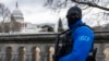 FILE - A United States Capitol Police officer stands guard on the grounds of the US Capitol building in Washington, Jan. 2, 2025. At least 14 people were killed and 30 injured on Jan. 1 when a vehicle plowed into a New Year's crowd in New Orleans. 